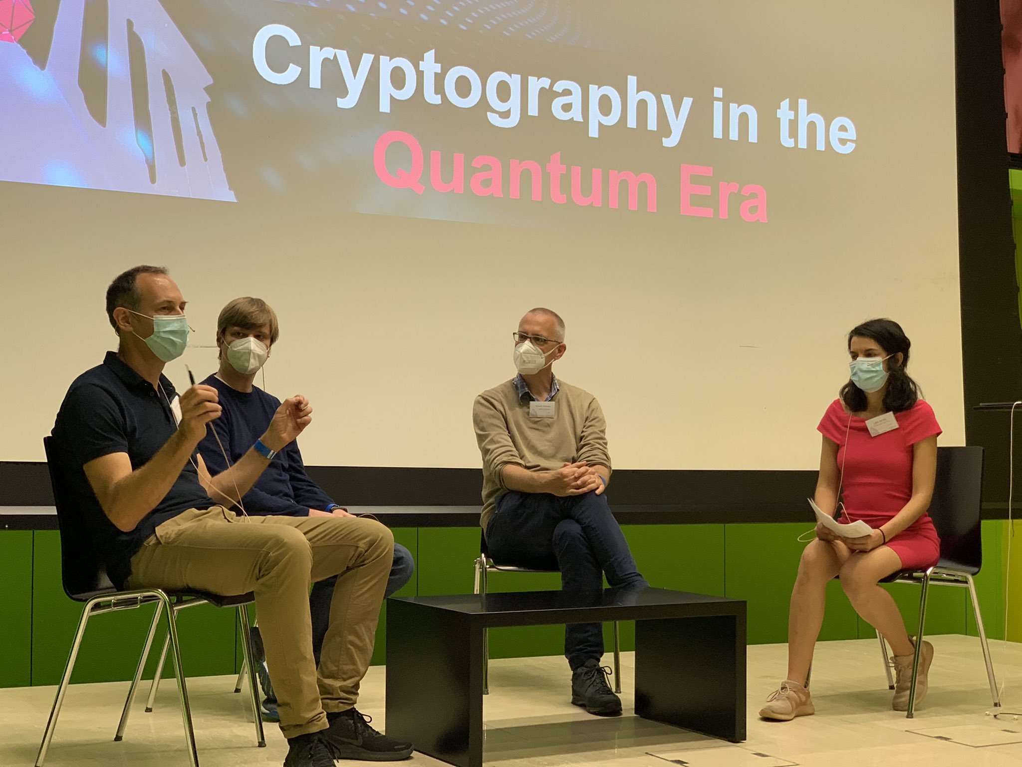 Panel discussion on cryptography in the quantum computing era with Dennis Hofheinz, Kenneth Paterson and Renato Renner, moderated by Lídia del Rio.